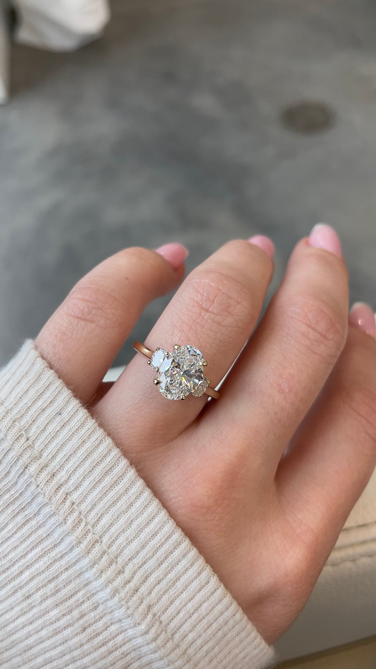 Three stone engagement ring on the hand