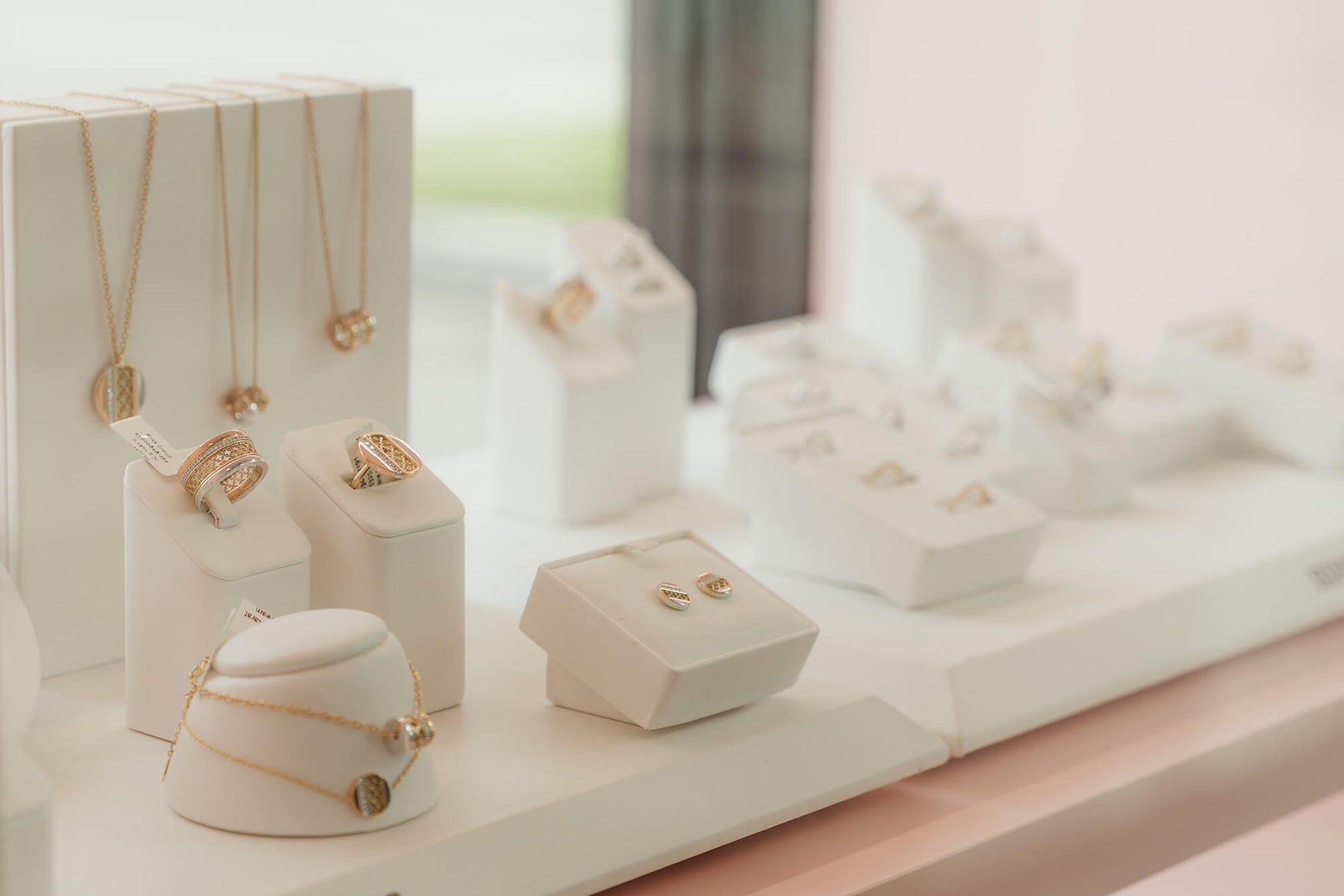 Gold necklaces on display at Perrara