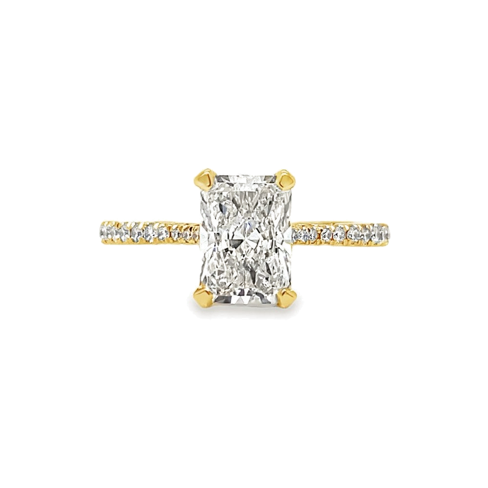 A radiant cut diamond engagement ring in yellow gold