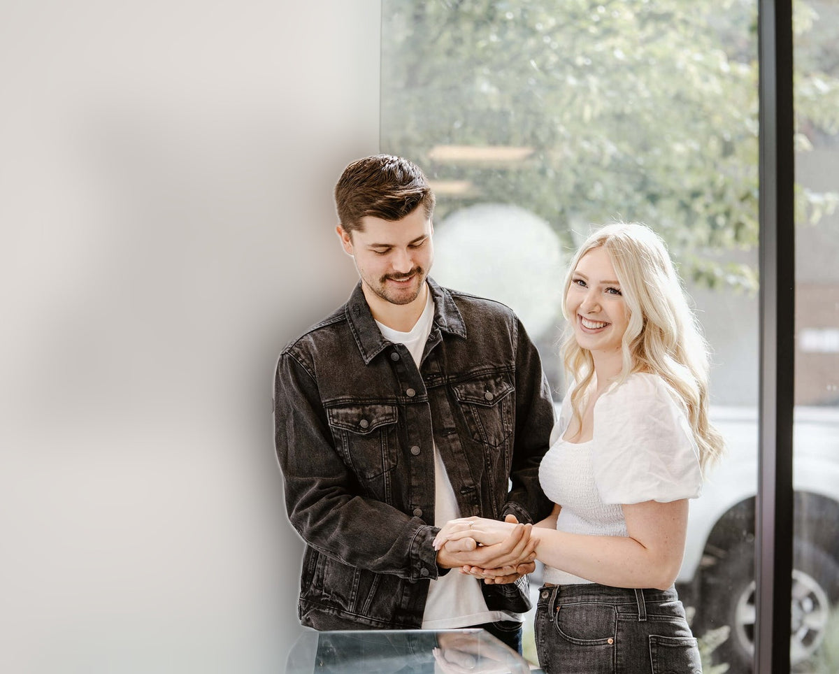 Couple together at the Perrara jewelry counter in Kelowna