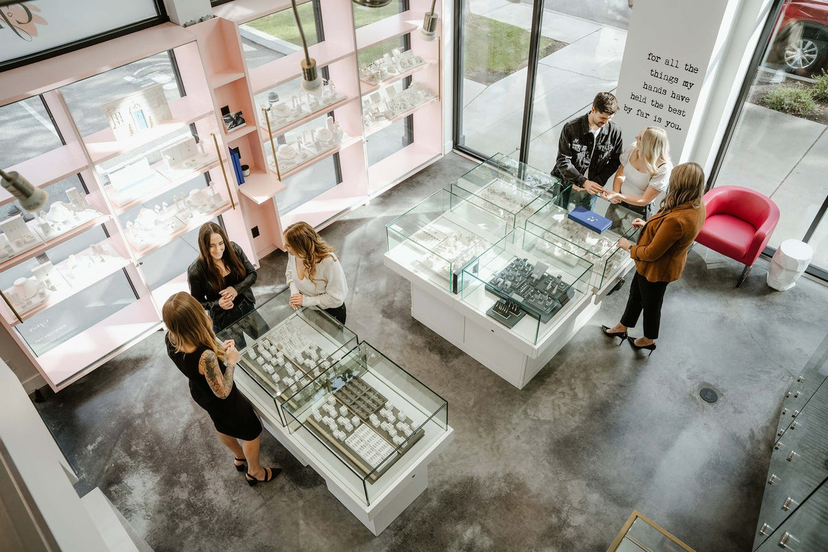 Customers at the cases inside Perrara Fine Jewelry in Kelowna, seen from above