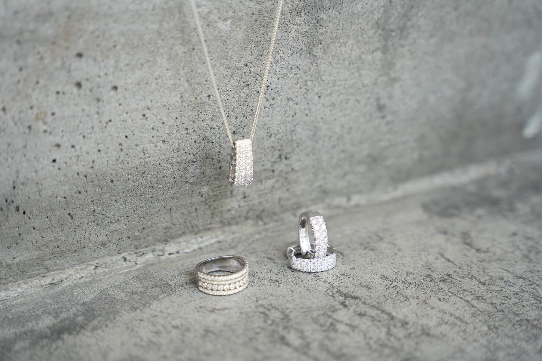 Lab grown diamond ring on concrete