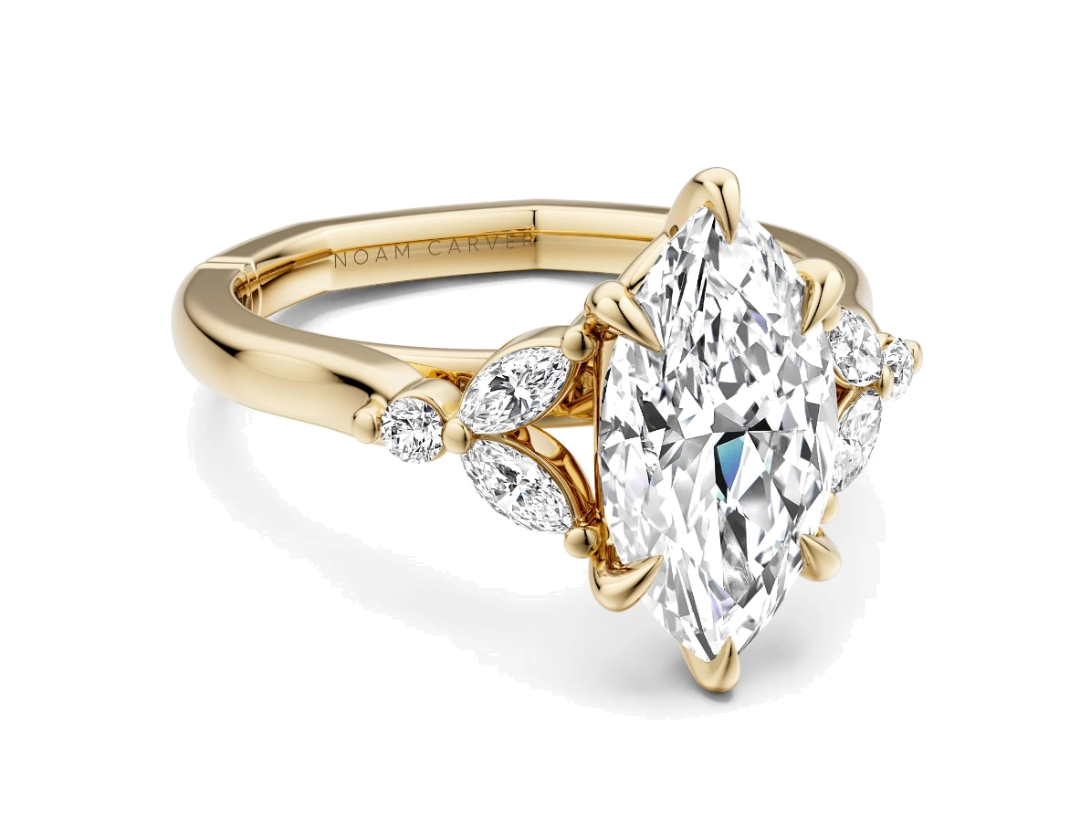 A marquise diamond engagement ring with marquise side stones by Noam Carver, in yellow gold