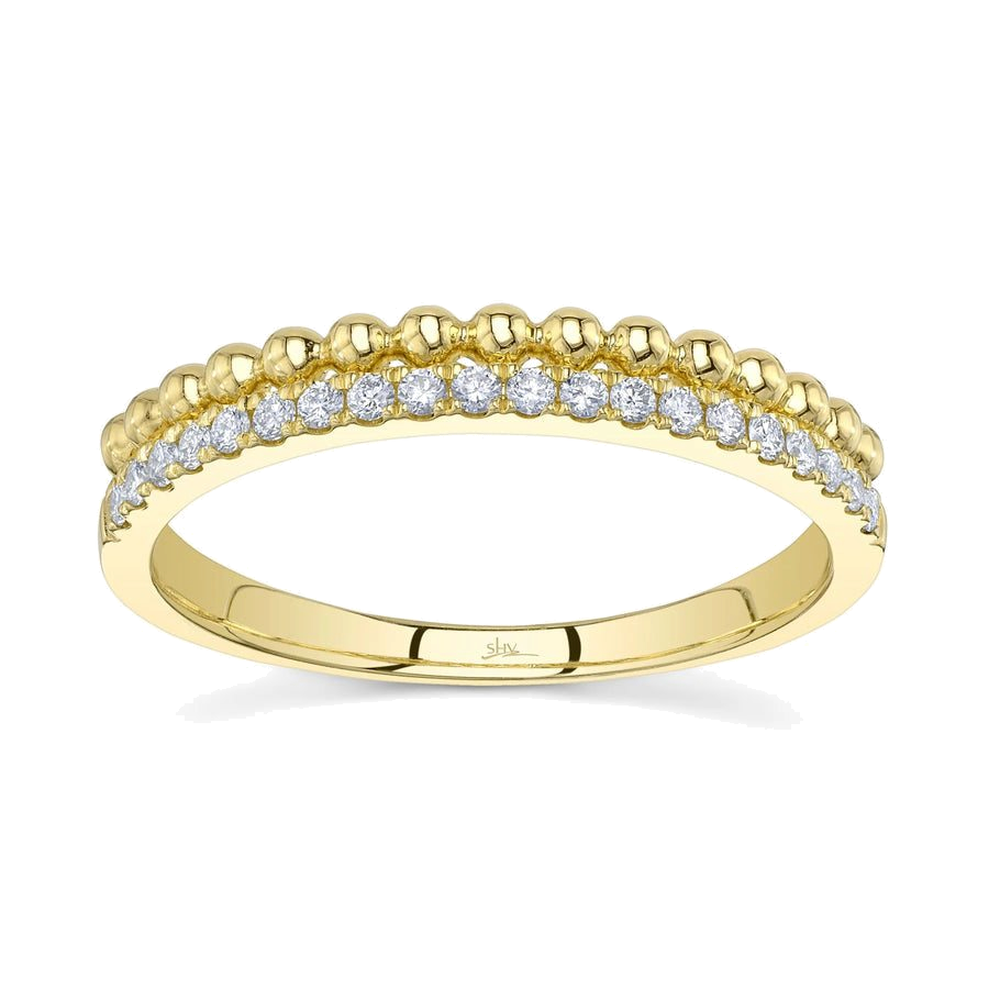 A stackable diamond ring in yellow gold